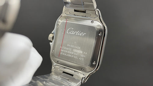 Stainless steel Cartier watch back with engraved details and folding clasp