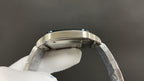 Stainless steel Cartier watch bezel and bracelet links viewed from above
