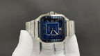 Stainless steel Cartier watch with blue dial and Roman-style markers
