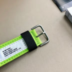 Neon green and black woven watch strap with metal buckle