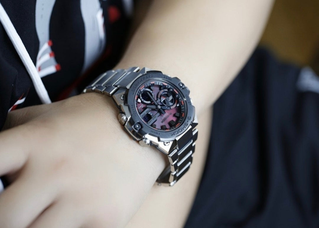 Casio G-Shock analog watch, dark metal case with textured bracelet