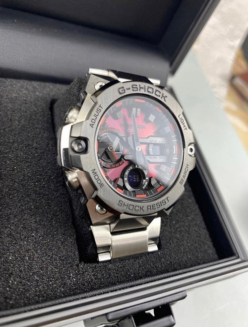 Casio G-Shock analog watch in open box, metal bracelet, black dial