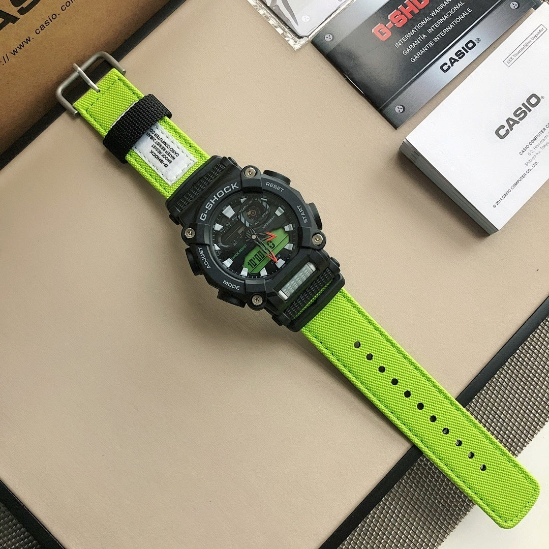 Casio G-Shock watch with black bezel and lime-green strap, dial facing up