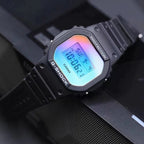 Casio G-Shock watch close-up with black case and neon blue digital display