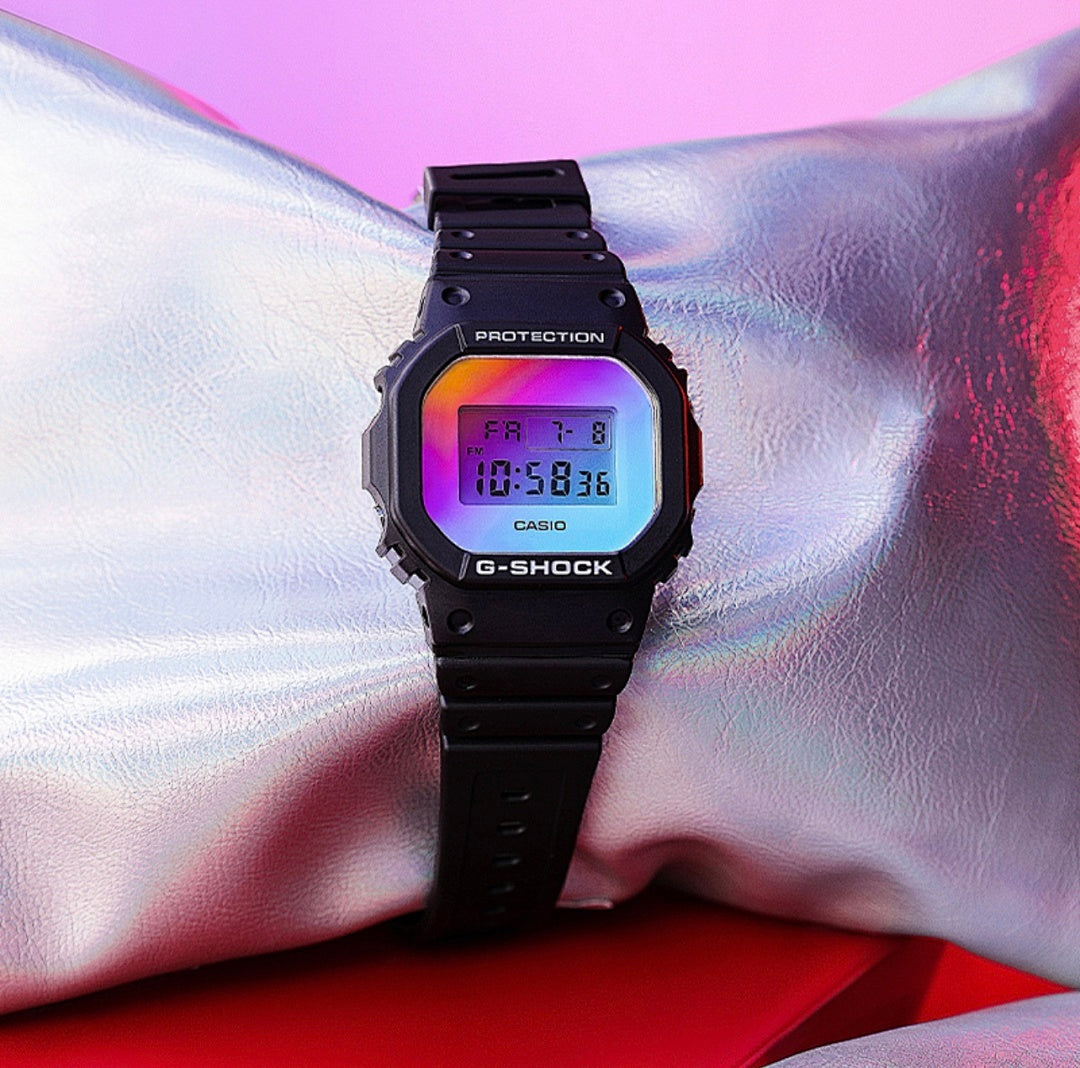 Casio G-Shock watch centered with black strap and colorful digital display