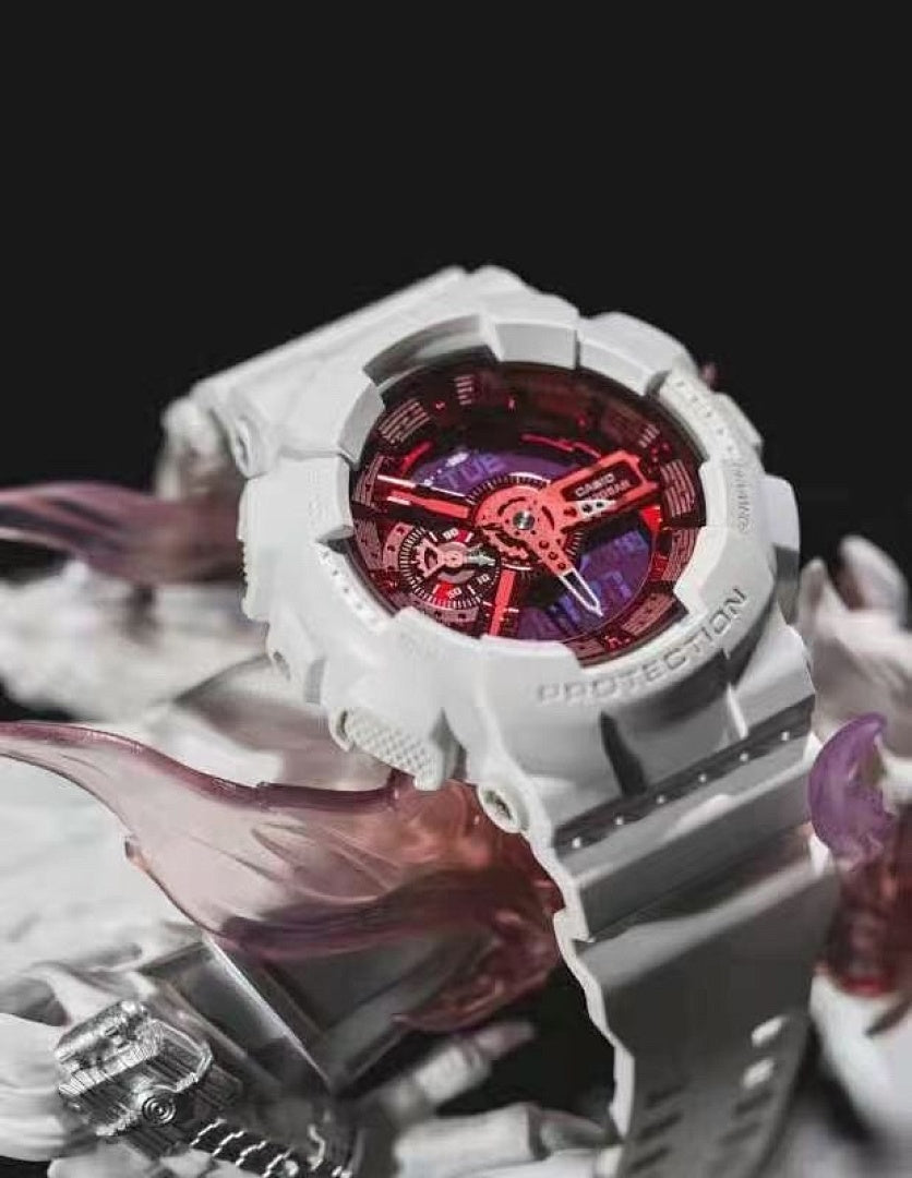 White resin wristwatch close-up with red and black dial details