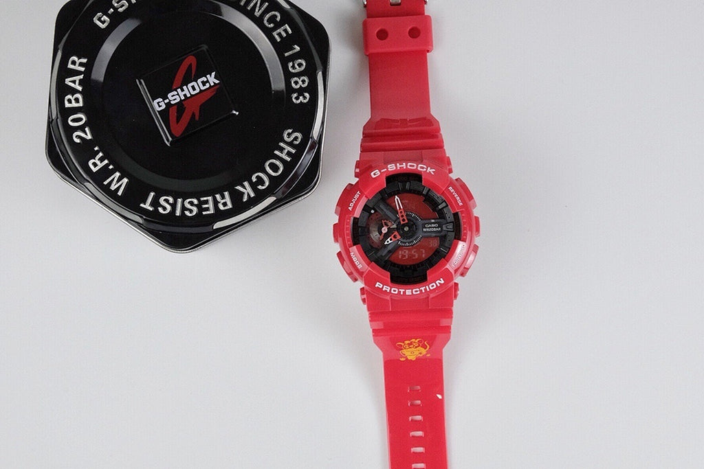 Casio wristwatch with red resin strap and black dial with red accents