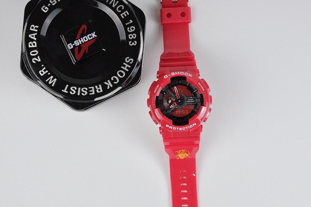 Casio wristwatch with red resin strap and black dial with red accents