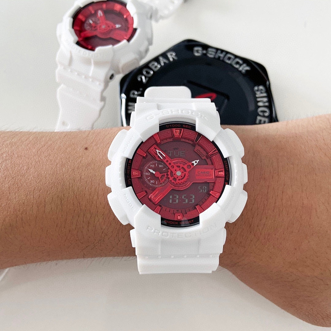 White resin wristwatch with red dial on a person’s wrist