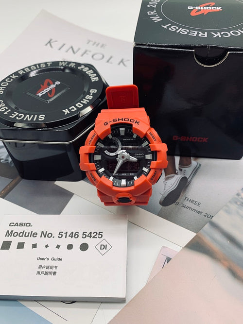 Casio G-Shock watch with orange strap and black bezel