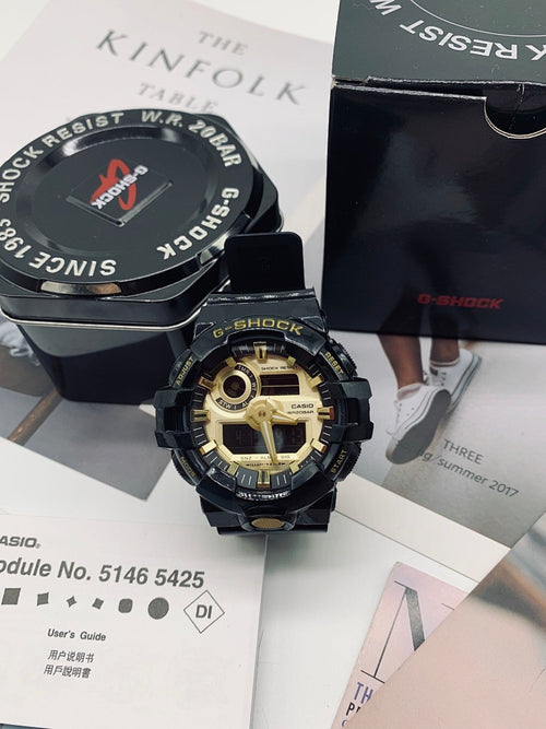 Casio G-Shock watch with black strap and gold-toned dial