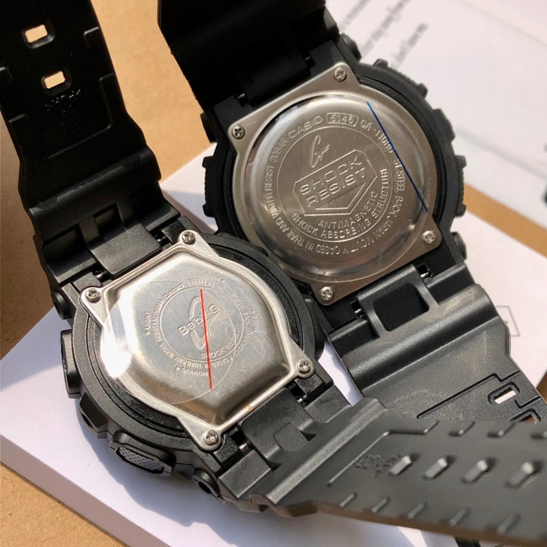Casio watch backs with metal case plates and black resin straps, clasp visible