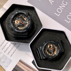 Casio G-Shock watches in hexagonal boxes with black resin straps and gold dials