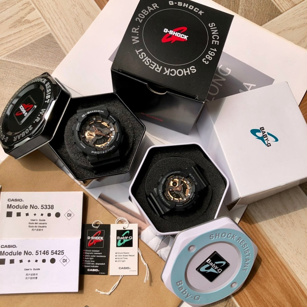 Casio G-Shock and Baby-G watches displayed in retail boxes, black and blue resin bands