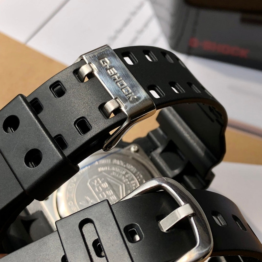 Casio watch buckle and clasp with brushed metal accents on black resin band