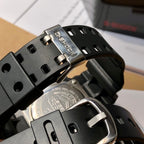 Casio watch buckle and clasp with brushed metal accents on black resin band