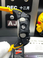 G-Shock Mudmaster wristwatch, side view of case with yellow strap and raised buttons