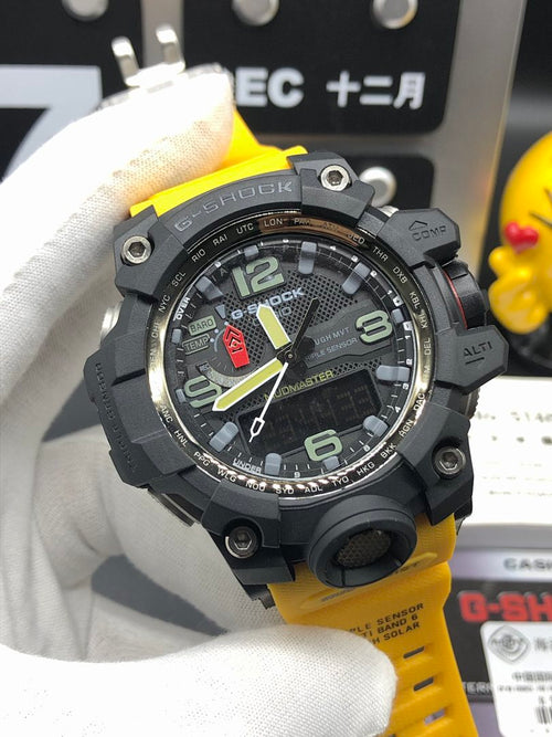 G-Shock Mudmaster wristwatch, angled view, black case with bezel and yellow resin strap