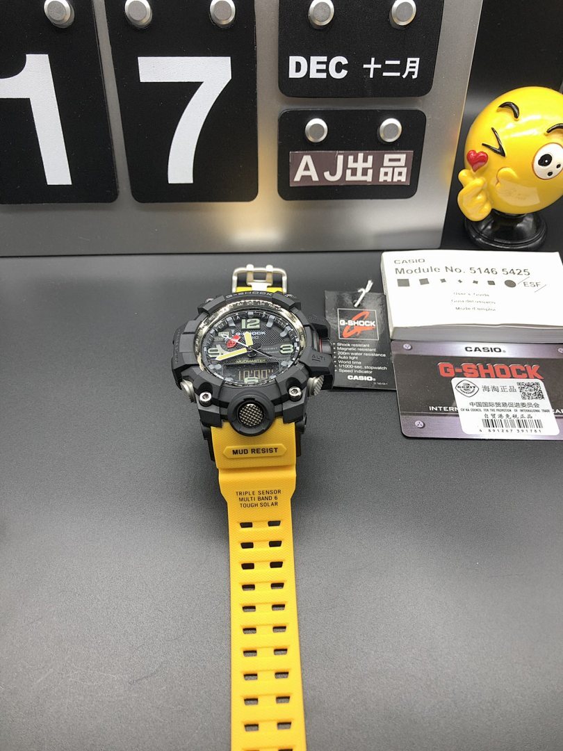 G-Shock Mudmaster wristwatch, display stand view with black case and yellow resin strap