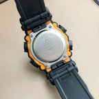 Round black G-SHOCK watch case with silver backplate and orange rim accents