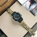 Casio G-Shock watch with tan camo fabric strap and black dial, top view