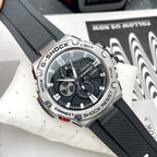 Casio G-Shock watch with black silicone strap and round black dial with silver markers