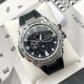 Casio G-Shock watch with black silicone strap and round black dial with silver bezel