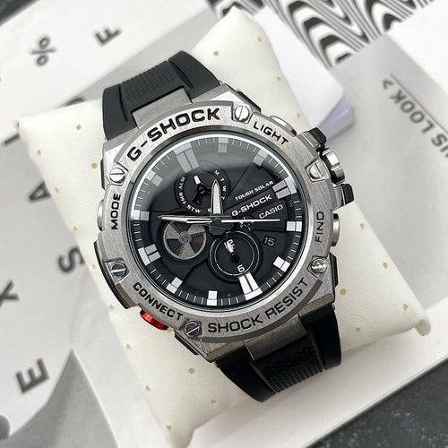 Casio G-Shock watch with black silicone strap and round black dial with silver bezel