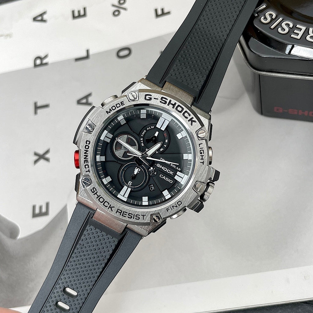 Casio G-Shock watch with black perforated silicone strap and round black dial