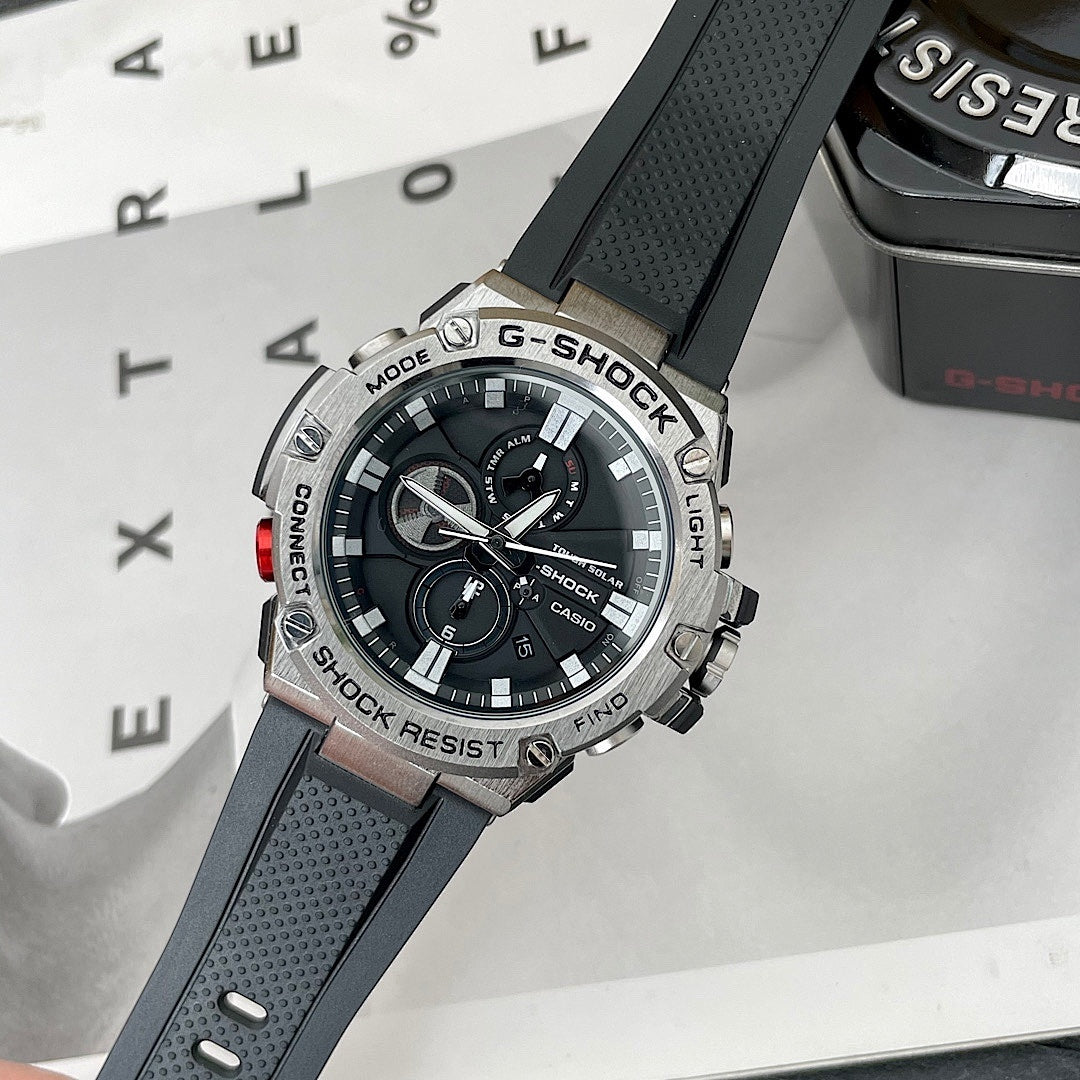 Casio G-Shock watch with black perforated silicone strap and round black dial