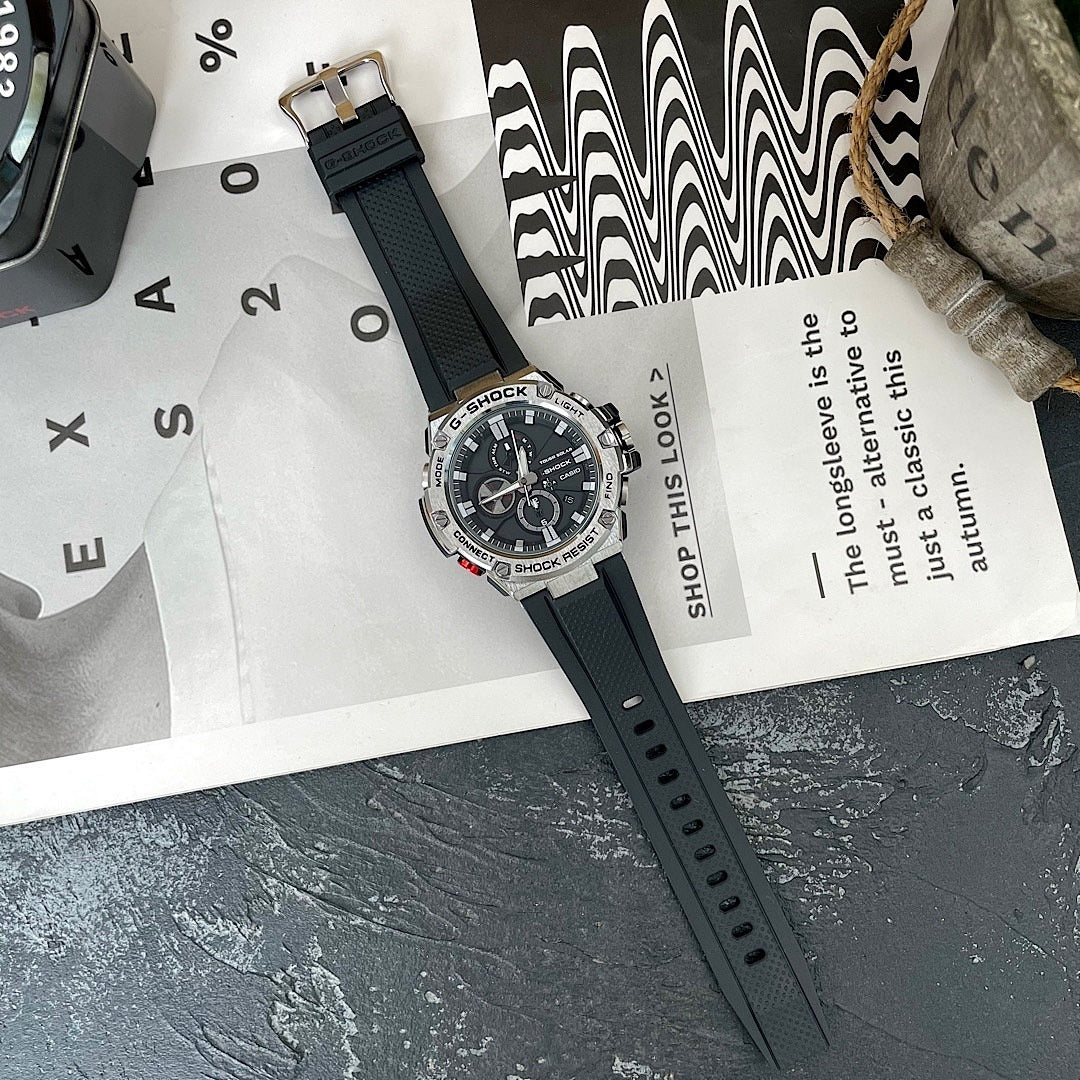 Casio G-Shock watch on packaging with black silicone strap and round black dial