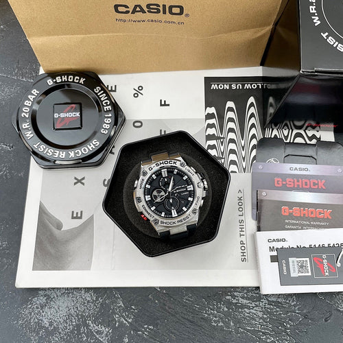 Casio G-Shock watch on box with black bezel, round dial, and black silicone strap