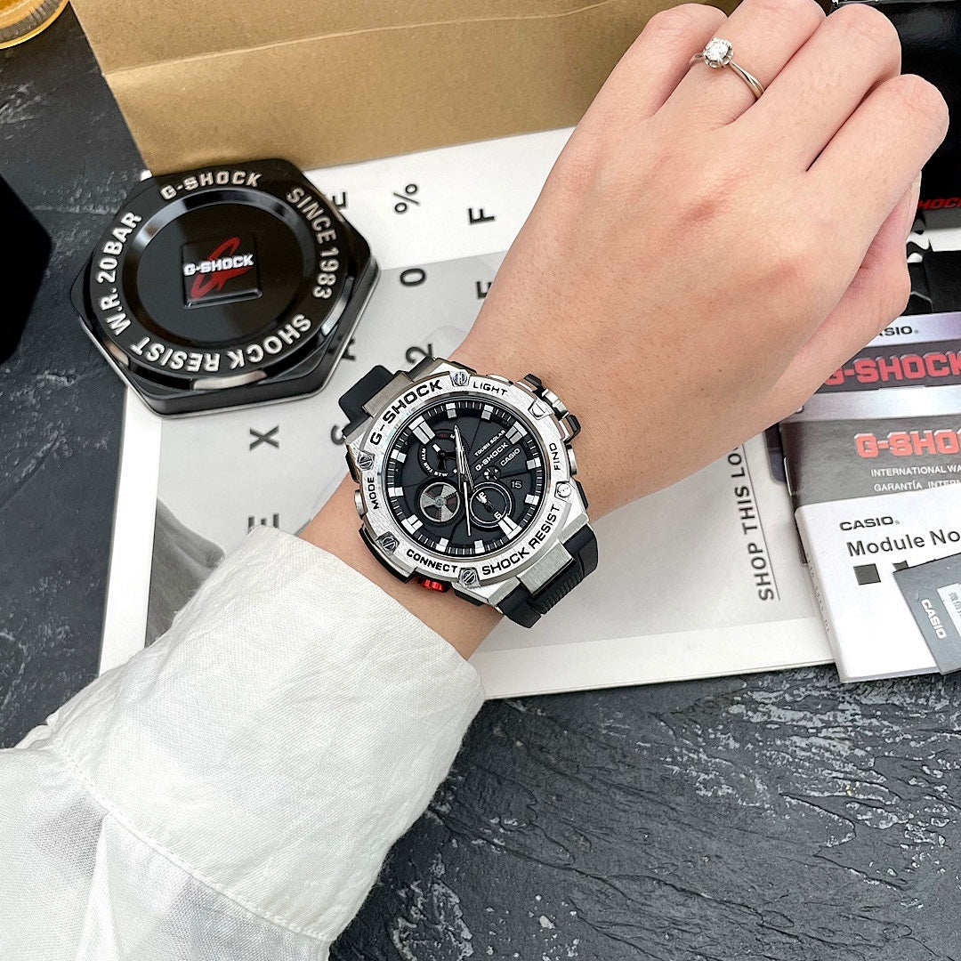 Casio G-Shock watch on wrist with black silicone strap and black dial with silver accents