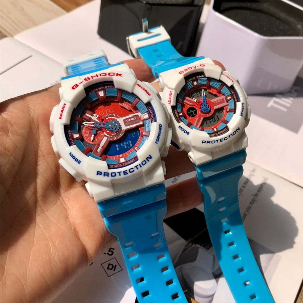 Casio G-Shock and Baby-G watches held in hand, white cases, blue straps