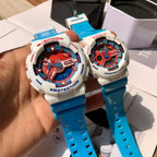 Casio G-Shock and Baby-G watches held in hand, white cases, blue straps