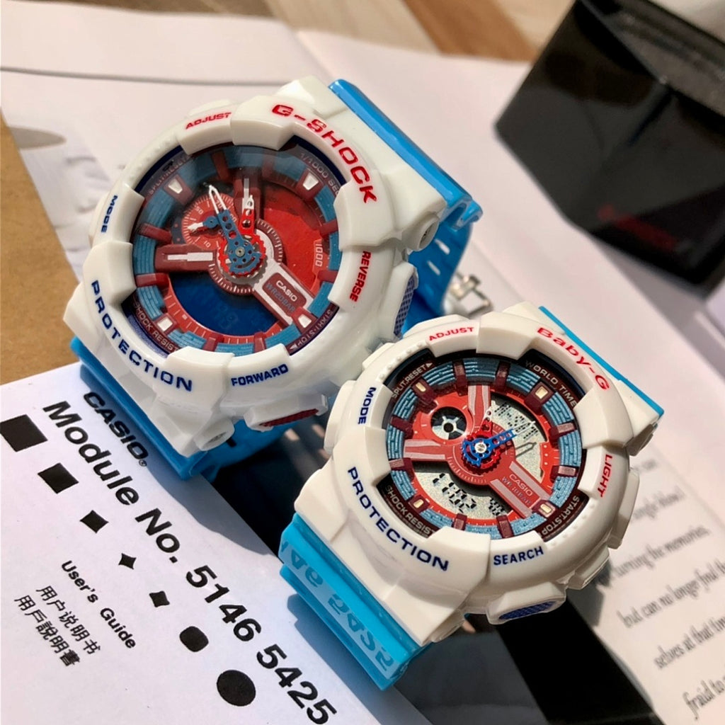 Casio G-Shock and Baby-G watches on box, white cases, red-blue dials, blue straps