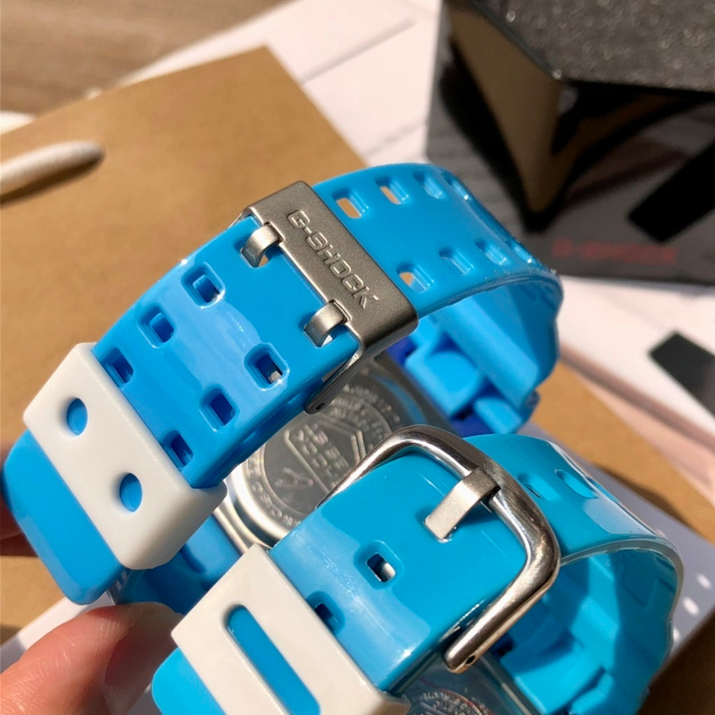 Casio G-Shock watch band clasp, blue silicone links with white inserts and metal hardware