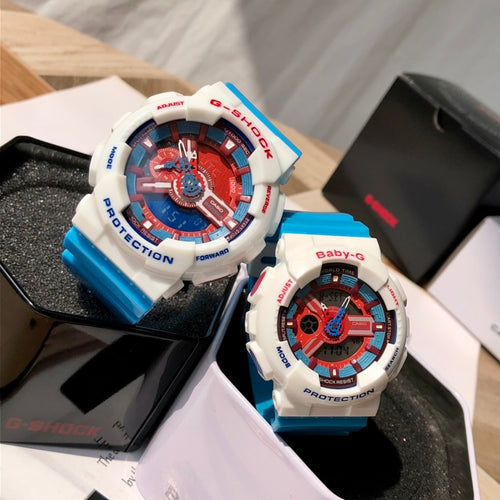 Casio G-Shock watch with white case, red-blue dial, blue silicone strap