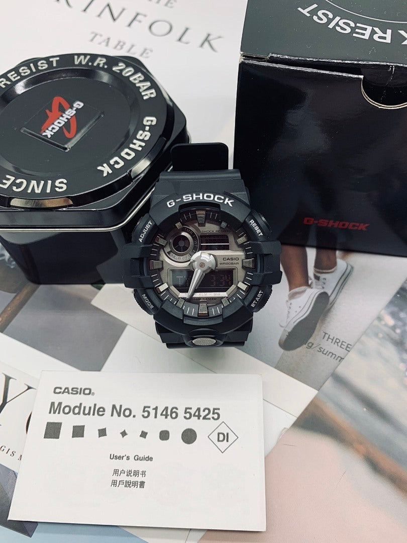 Casio G-Shock watch with dark dial and black resin strap