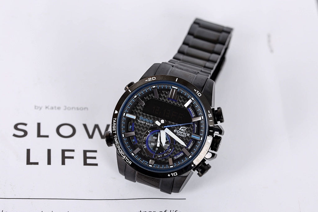 Casio G-Shock watch with black strap and blue subdials, on display