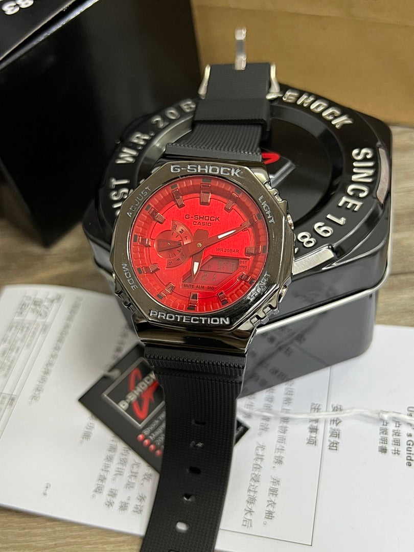 Casio G-Shock wristwatch with red digital face and black silicone strap, silver-tone bezel