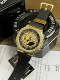 Casio G-Shock wristwatch with gold-tone bezel and black silicone strap, round analog-digital face