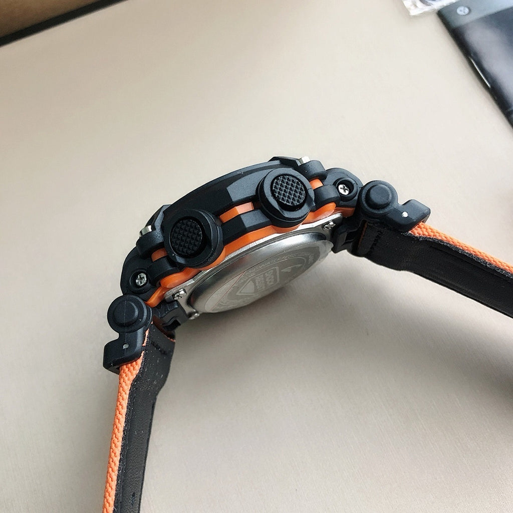 G-Shock wristwatch side view with orange bezel rings and black resin case
