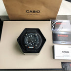 Casio G-Shock wristwatch with black dial, orange accent, and textured black strap