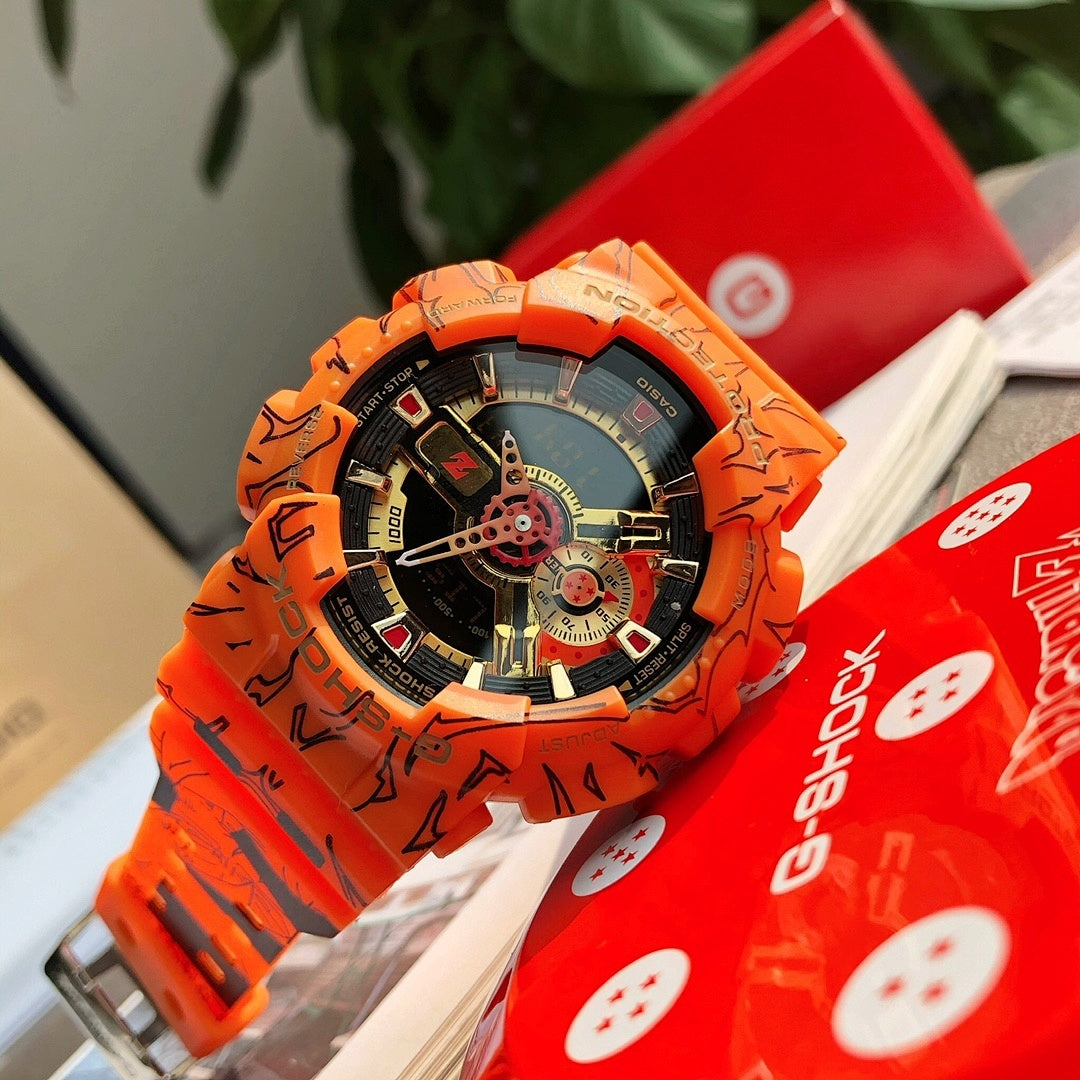 Orange Casio watch with round dial, gold-toned hands, and graffiti resin band