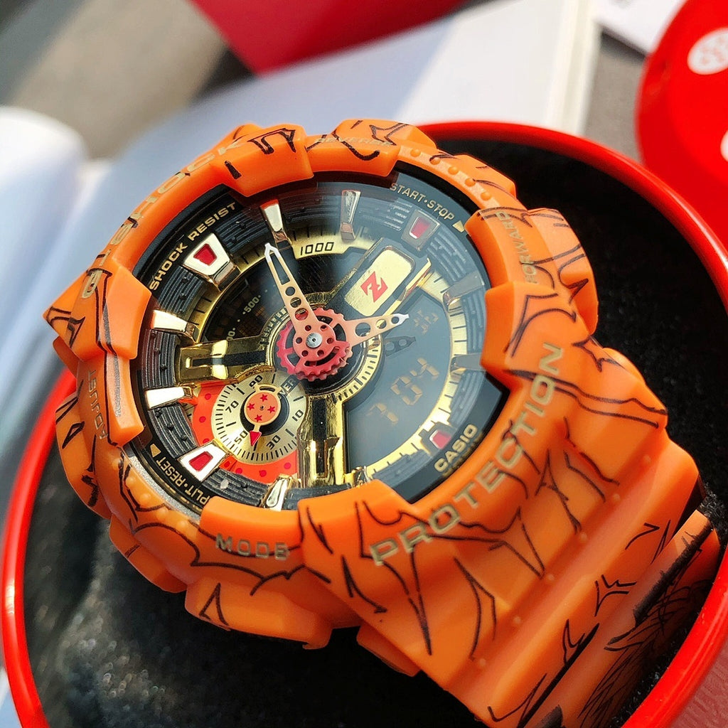 Orange Casio watch close-up of dial with multi-dial layout and graffiti bezel
