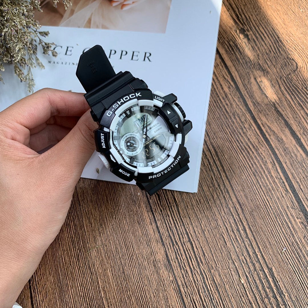 Casio G-Shock digital wristwatch on hand, black bezel with silver-and-black dial details