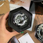 Casio G-Shock digital wristwatch in a black display case, rugged black bezel and dial