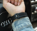 Casio G-Shock black resin watch with perforated strap on wrist