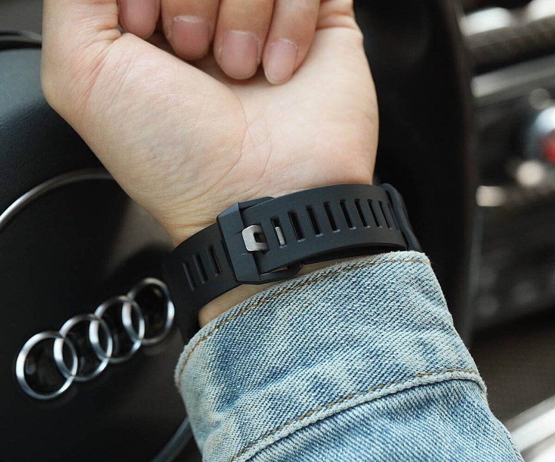 Casio G-Shock black resin watch with perforated strap on wrist